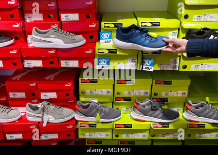 Sport shoes in a footwear store Stock Photo