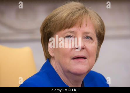 Washington, USA. 27th Apr, 2018. United States President Trump meets with Chancellor Angela Merkel of Germany, in the Oval Office of the White House in Washington, DC, April 27, 2018. - NO WIRE SERVICE - Credit: Chris Kleponis/Consolidated/dpa/Alamy Live News Stock Photo