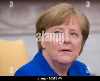 Washington, USA. 27th Apr, 2018. United States President Trump meets with Chancellor Angela Merkel of Germany, in the Oval Office of the White House in Washington, DC, April 27, 2018. - NO WIRE SERVICE - Credit: Chris Kleponis/Consolidated/dpa/Alamy Live News Stock Photo