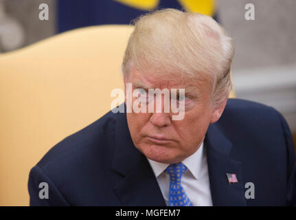 Washington, USA. 27th Apr, 2018. United States President Donald J. Trump meets with Chancellor Merkel of Germany, in the Oval Office of the White House in Washington, DC, April 27, 2018. - NO WIRE SERVICE - Credit: Chris Kleponis/Consolidated/dpa/Alamy Live News Stock Photo