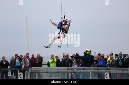 Brighton, Sussex UK 28th April 2018 -  Participants Abseil 450 feet from Brighton's iconic British Airways i360 observation tower during a Charity Abseil in aid of the children’s charity Rockinghorse the fundraising arm of the Royal Alexandra Children’s Hospital in Brighton. Credit: James Boardman/Alamy Live News Stock Photo