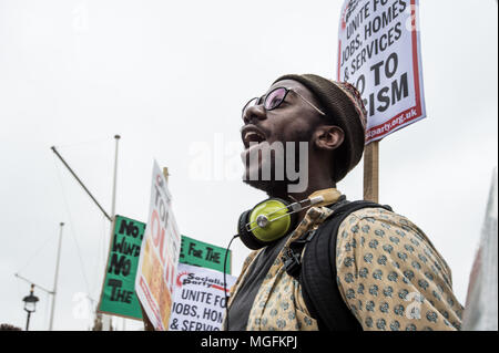 London, UK, 28 April 2018. A protester seen shouting slogan during the march. The Windrush generation solidarity protest gathered around 200 people at the Churchill Statue in Parliament Square to show disgust at the government's treatment of those from the Windrush generation. 'Despite the government's recent actions to attempt to rectify it, this never should have happened in the first place', they say. Credit: SOPA Images Limited/Alamy Live News Stock Photo