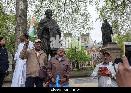 London, UK, 28 April 2018. Local British originally from India protested peacefully at the base of Mahatma Gandhi statue. They sat/protested from 10am to 1pm against the desecration of the Indian flag. The British government is under growing pressure to take action against protesters behind the desecration of the Indian flag at Parliament Square in London during Prime Minister Narendra Modi's UK visit last week. Credit: Paul Quayle/Alamy Live News Stock Photo