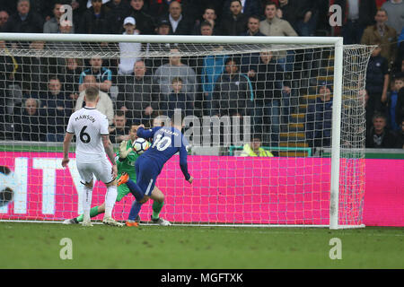 Swansea, UK. . 28th Apr, 2018. Eden Hazard of Chelsea has a shot at goal saved by Swansea city goalkeeper Lukasz Fabianski. Premier League match, Swansea city v Chelsea at the Liberty Stadium in Swansea, South Wales on Saturday 28th April 2018.  this image may only be used for Editorial purposes. Editorial use only, license required for commercial use. No use in betting, games or a single club/league/player publications. pic by Andrew Orchard/Andrew Orchard sports photography/Alamy Live news Credit: Andrew Orchard sports photography/Alamy Live News Stock Photo