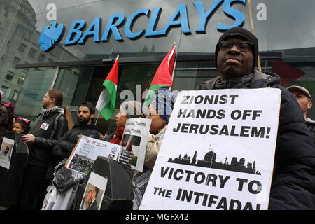 Manchester, UK. 28 April 2018. Palestine Solidarity demonstrators picket Barclays Bank in the city of Manchester. The demonstrators were protesting for the rights of the people of Gaza and against the complicity of British firms and Banking Institutions who contribute either materially or financially to Israel and its arms trade. Credit: SOPA Images Limited/Alamy Live News Stock Photo