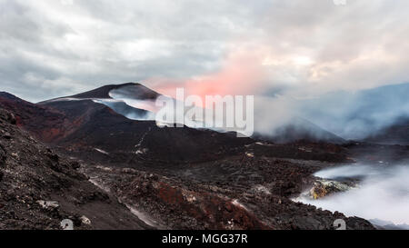 Eruption of volcano Tolbachik at sunset, Kamchatka Peninsula, Russia Stock Photo