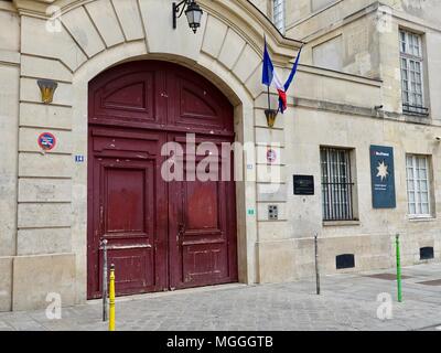 Red doors of the Lycée Charlemagne (French high school), located in the Marais, Paris, France. Stock Photo