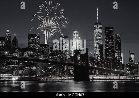 Fireworks over New York City skyline and Brooklyn Bridge Stock Photo