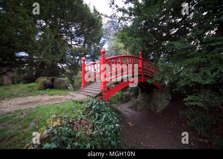 Traditional Asian red wooden bridge at parc boulogne-edmond de rothschild Stock Photo