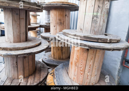 Close up shot of some big empty cable reels. Stock Photo