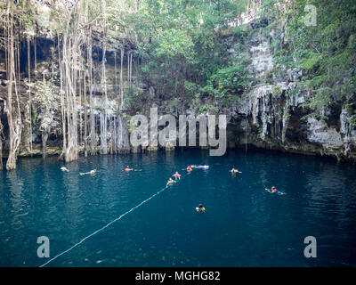 Yokdzonot, Chichen Itza, Mexico, South America: [Yokdzonot cenote, natural pit sinkhole, swimming and relaxing tourist attraction in Mexico Stock Photo