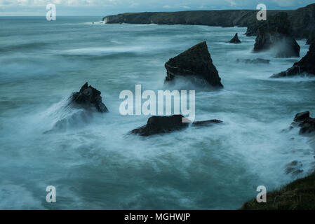 ghostly waves breaking on rocks at Bedruthan, North Cornwall Stock Photo