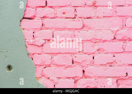 Beautiful abstract background from concrete and Painted pink brick wall texture urban background with space for text. Exposed brick on damaged wall
