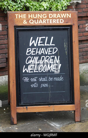 blackboard saying, Well behaved children welcome, the rest shall be made into pies, hung drawn and quartered pub, London Stock Photo