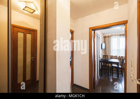 Modern living flat interior, hallway with open door and window Stock Photo