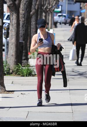 Lucy Hale sports bright red leggings as she gets in her workout at Training  Mate in