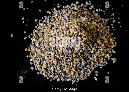 Brown sugar is a sucrose sugar product with a distinctive brown color due to the presence of molasses Stock Photo