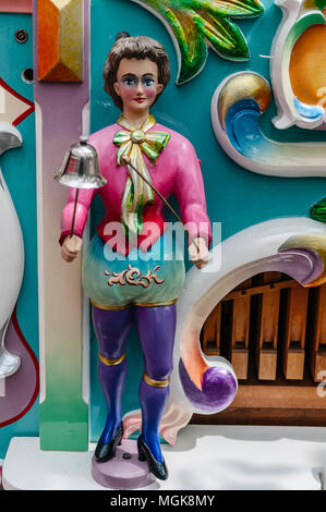 old Dutch barrel organ wood doll with a bell in his hand Stock Photo