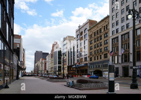 Detroit, Michigan/USA - April 7th, 2018 :A wall of vintage buildings on an empty boulevard at dusk. Stock Photo