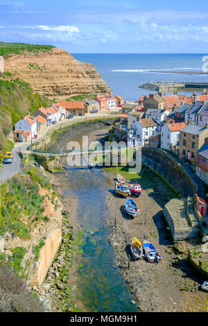 The view looking seawards over the harbour of the North Yorkshire Village of Staithes with Cowbar on the North side of Roxby Beck Stock Photo