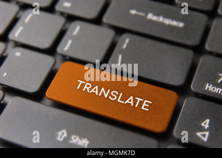 Language translation service concept, red computer button with translate text for multilingual support. Stock Photo