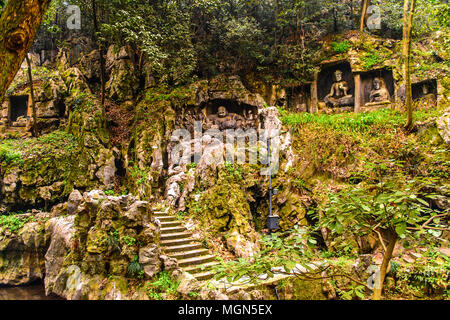 Rock reliefs at Feilai Feng at the Lingyin Temple (Temple of the Soul's Retreat) complex. One of the largest Buddhist temples in China Stock Photo