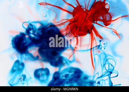 Blue and Red Dye in Water Stock Photo
