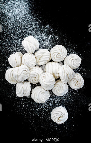 Handmade White Zefir on the Black Background Stock Photo