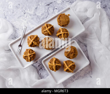 Hot Cross Muffins for Easter, brightly lit table scene Stock Photo