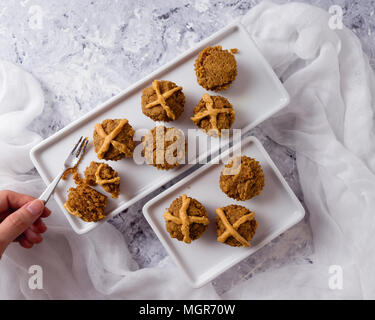Hot Cross Muffins for Easter, brightly lit table scene Stock Photo