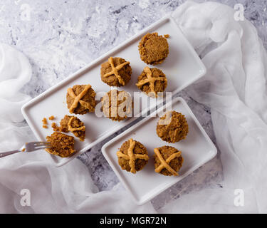 Hot Cross Muffins for Easter, brightly lit table scene Stock Photo