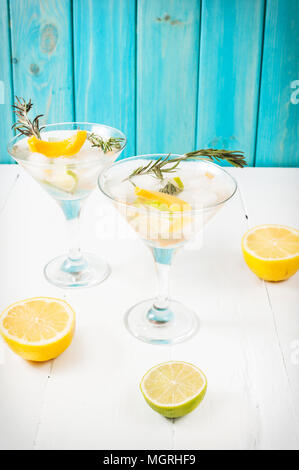 Gin,lemon, rosemary fizz, cocktail with honey and fresh herbs on a white background. Stock Photo