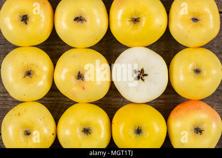 Fresh yellow apples on wooden background Stock Photo