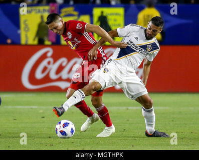 Los Angeles, California, USA. 28th Apr, 2018. New York Red Bulls' midfielder Sean Davis (27) vies with Los Angeles Galaxy's midfielder Sebastian Lletget (17) during the 2018 Major League Soccer (MLS) match between Los Angeles Galaxy and New York Red Bulls in Carson, California, April 28, 2018. New York Red Bulls won 3-2 Credit: Ringo Chiu/ZUMA Wire/Alamy Live News Stock Photo