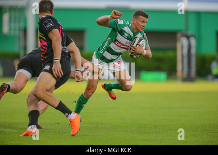 Treviso, Italy. 28th April, 2018. Benetton's second centre Tommaso Iannone breaks a tackle in the match against Zebre Rugby Club in GuinnessPro14©Massimiliano Carnabuci/Alamy Live news Stock Photo