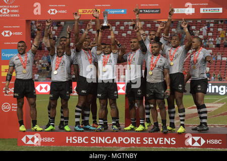 Singapore. 29th April 2018. Fiji's players lift the trophy after winning the final of the HSBC World Rugby Sevens Series Singapore Cup in Singapore, on April 29, 2018. Credit: Then Chih Wey/Xinhua/Alamy Live News Stock Photo