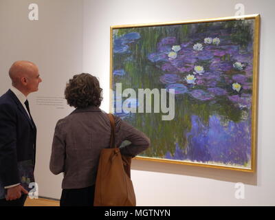 New York, USA. 27 April 2018.  The painting 'Nympheas en fleur' by the painter Claude Monet hangs in the Christie's auction house in New York. The painting is to be auctioned off as part of the art collection of the late US billionaire David Rockefeller. Photo: Johannes Schmitt-Tegge/dpa Credit: dpa picture alliance/Alamy Live News Stock Photo