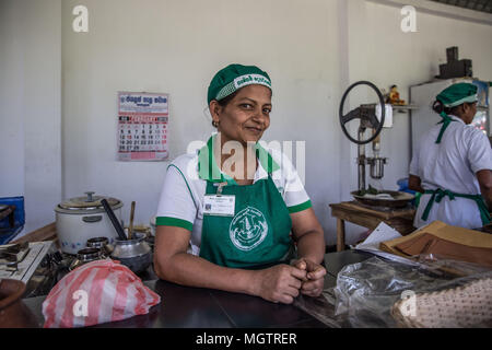 Kandy, Sri Lanka. 15th Feb, 2018. WASANTHA MENIKE smiles while working at the Hela Bojun Hala in the Kundasale suburb of Kandy, Sri Lanka, on Thursday, February 15, 2018.Wasantha worked in Saudi Arabia 10 years as housemaid, providing the sole income for her family. She continues to be the family's sole provider, currently working at the cafÅ½ from 6:30 in the morning until approximately 1:00pm each week day. She has two children, ages 18 and 20. Hela Bojun food courts, scattered throughout the country, are open kitchens that serve traditional Sri Lankan food at subsidized prices. The Stock Photo