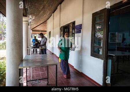 Dr. 18th Feb, 2018. MANOHARI moves between her four-legged patients at the Government Veterinary Hospital clinic in the Peradeniya region of Kandy, Sri Lanka, on Sunday, February 18, 2018.MANOHARI, a Hindu, married in 1991. She started her veterinary practice in 1992 while she was pregnant. She started working at this hospital in 1993.She and her husband, a Muslim, have two sons and a daughter. Her sons are currently studying for higher degrees in the United States and Nepal.MANOHARI looks after her 86-year-old mother who is experiencing dementia. (Credit Image: © Tracy Barbutes via Z Stock Photo