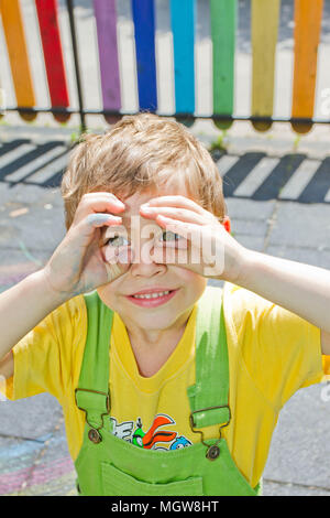 Boy. Portrait of cute boy kid in sunny day. Portrait of Happy blond child smiling. Boy looking at the camera with a handsome smile on his face. Summer Stock Photo