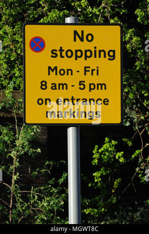 Parking restriction sign outside a school on Beaumont Leys Lane, Leicester, Leicestershire, England Stock Photo