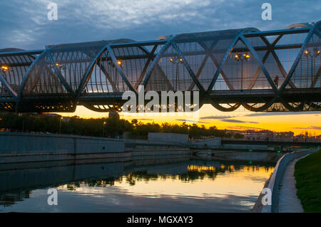 Bridge by Perrault and river Manzanares, night view. Madrid Rio park, Madrid, Spain. Stock Photo