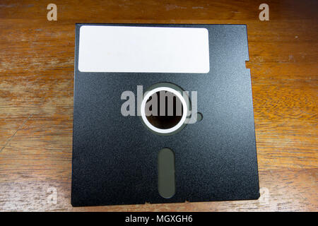 A 5¼-inchfloppy disk sitting on a table. Stock Photo