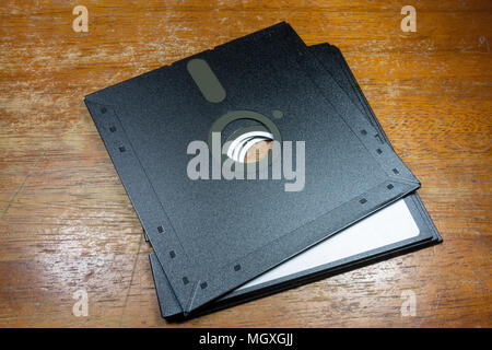 A pair of 5¼-inch floppy disks sitting on a table. Stock Photo
