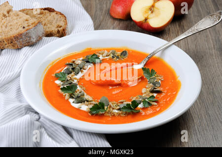 A wipe of pumpkin-apple soup with a tender, soft consistence,  yoghurt  and seasoned with pumpkin seeds and sunflower seeds. This is what you need for Stock Photo