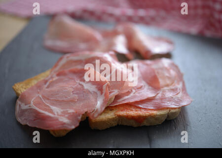 Sandwiches with jamon on a slate surface Stock Photo