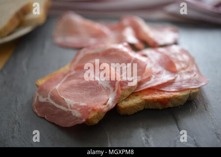 Sandwiches with jamon on a slate surface Stock Photo