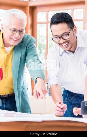 Cheerful professional team working on an innovative project Stock Photo