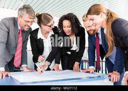 Group of business people analyzing data Stock Photo