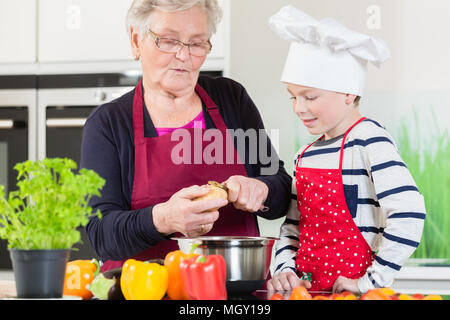 Grandma and grandson cooking together Stock Photo